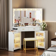 a white vanity with lights on it in a bedroom