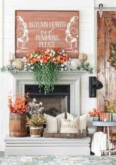 a living room filled with furniture and flowers on top of a mantel above a fire place