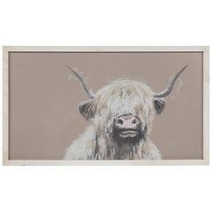 a painting of a cow with horns on it's head is displayed in a white frame