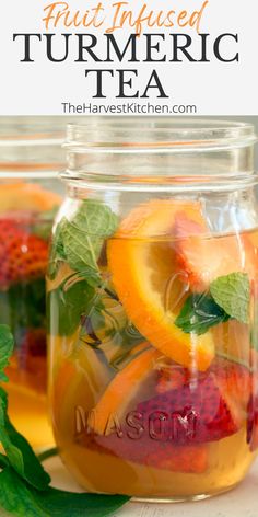 a mason jar filled with sliced fruit and mint