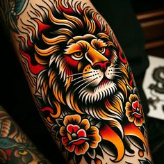 a lion tattoo on the arm with flowers around its neck and chest, in front of a black background