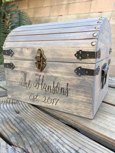 a wooden trunk with the name of someone's wedding date on it