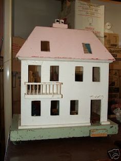 a doll house sitting on top of a table