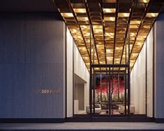 the entrance to an upscale hotel at night