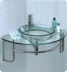 a bathroom sink with a glass shelf above it