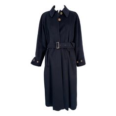 Giorgio Armani Classico, Black Label, navy blue cashmere over coat. Dark navy cashmere coat with tab & adjustable button cuffs, long raglan sleeves. The coat closes at the front with a placket & hidden buttons to the neck. There are shaped flange hip front pockets. The coat is semi full and has belt loops at the waist sides, it comes with the original self belt. The back has a deep center hem vent. Pre-owned and in very good condition. The Classico label was the most expensive. In excellent wear Over Coat, Cashmere Coat, Outerwear Coats, Black Label, Dark Navy, Giorgio Armani, Raglan Sleeve, Ready To Wear, Cashmere