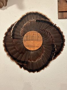 a piece of wood that has been cut in half and is hanging on the wall