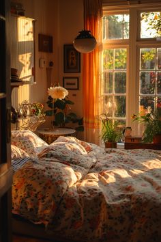 the sun shines through two windows onto a bed in a room with floral bedspread