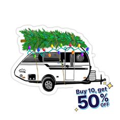 an rv with a christmas tree on the roof and 50 % off sticker below it