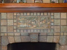 a fireplace with a painting on the mantle