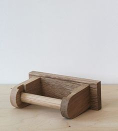 a wooden object sitting on top of a table