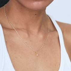 The sweetest mini initial charm adorns our best-selling gold & silver mixed shimmer chain. Layer your initials or your loved ones for a personalized addition to your stack. Choose from 16" or 18" Sterling silver, nickel-free chain with a 5x8mm 24k gold plated brass charm with cubic zirconia detail. Comes packaged in our signature lavender pouch.