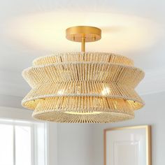 a chandelier hanging from the ceiling in a room