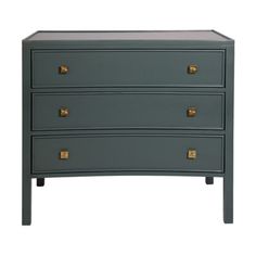 a grey chest of drawers with gold handles