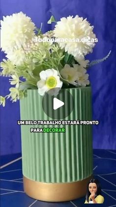 there is a vase with flowers in it on the table