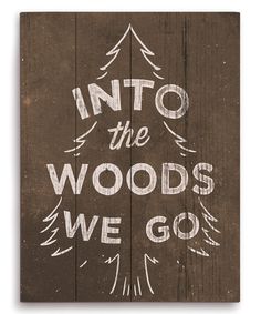 a wooden sign that says into the woods we go, on top of a green background