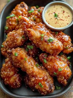 chicken wings with dipping sauce on the side