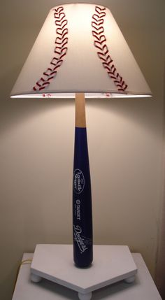 a lamp that has a baseball on it