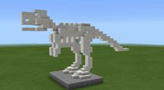 an animal made out of lego blocks in the middle of a grassy area with blue sky