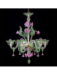 a green chandelier with pink flowers on it