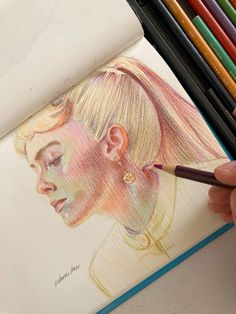 a drawing of a woman's face in colored pencils