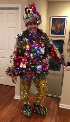 a man dressed up as a christmas tree