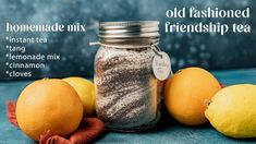 three lemons and two oranges are next to a glass jar with homemade mix