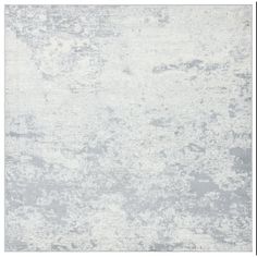 an area rug with white and gray colors