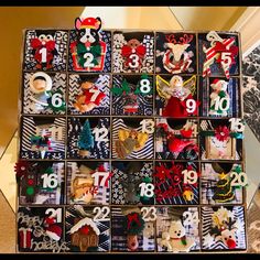 a box filled with lots of different types of christmas decorations on top of a table