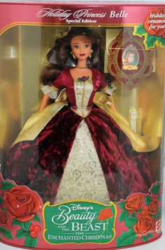 the disney princess doll is in its box with red and gold trimmings on it