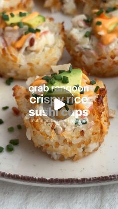 crab and rice sushi cups on a white plate with green garnishes