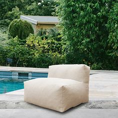 a chair sitting in front of a swimming pool