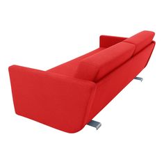 a red couch sitting on top of a white floor next to a metal leg rest