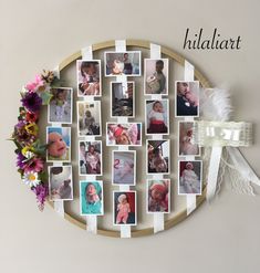 a wooden circle with pictures on it and flowers hanging from the wall next to it