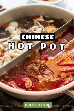 chinese hot pot with noodles and vegetables in it