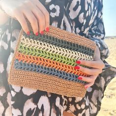 This eye-catching clutch bag is handmade using raffia yarn. With dimensions of 25 cm wide and 20 cm tall, it is both convenient to carry and practical to use.  The vibrant and varied colors used in the bag's design make it a perfect accessory for the summer. Thanks to the durable raffia yarn, you can use your clutch comfortably for a lifetime.  The colorful and stylish design of the bag will add an elegant touch to your style at the beach, during daily outings, or at special events. The tassel d Colorful Clutch, Unique Clutch, August Birthstone Jewelry, July Birthstone Jewelry, Zodiac Gifts, Cloth Bag, Gifts For New Mums, Jewelry Ring Box, Pearl Jewellery Earrings