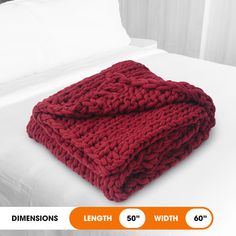 a red blanket on top of a bed next to white sheets and pillows with the words dimensionss below it