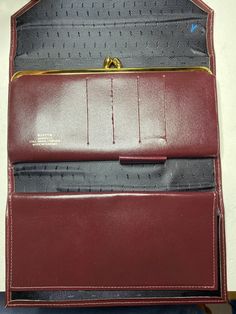 Here's an absolutely beautiful ladies Buxton wallet. The wallet is in brand new condition with only a few marks here and there. It was made in Canada which is very rare. The colour is a deep burgundy and it is very soft to the touch. It does have a Y and a R drawn in the inside. My guess is quality control. This would make an excellent gift to that special someone in your life  Please message me with any questions Classic Burgundy Wallet With Card Slots, Formal Burgundy Wallets With Card Slots, Classic Burgundy Wallets With Interior Card Slots, Classic Burgundy Wallet With Interior Card Slots, Classic Burgundy Rectangular Wallets, Formal Burgundy Rectangular Wallet, Vintage Business Wallet With Coin Pocket, Vintage Wallets With Coin Pocket For Business, Classic Burgundy Wallet For Business