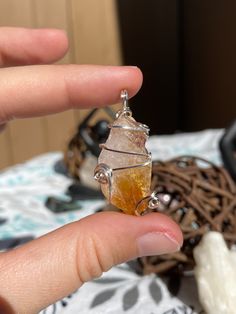 This honey calcite point pendant is wrapped with flat silver wire and features a swirly design.  Honey Calcite features metaphysical properties such as: encouraging feelings of self worth, confidence and courage, assists to overcome obstacles, and removes blockages from the heart and mind. Wire Wrapped Citrine Jewelry For Healing, Citrine Wire Wrapped Jewelry For Healing, Wire Wrapped Silver Crystals For Healing, Spiritual Citrine Pendant Crystal Necklace, Hand Wrapped Spiritual Crystal Pendants, Spiritual Hand Wrapped Crystal Pendant, Spiritual Hand Wrapped Pendant Crystals, Spiritual Hand-wrapped Pendant Crystals, Wire Wrapped Spiritual Crystals For Healing