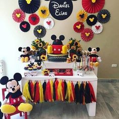 a mickey mouse themed birthday party with decorations