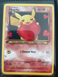 a pokemon trading card with pikachu holding a heart