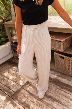 Beige linen pants-trousers that feature classic black stripes, as well as belt loops, pockets on the sides and a flowy-comfortable fit. These pants are not lined, but are not sheer making them the perfect wardrobe addition for any occasion! Our model also wears the Black Lauren T-Shirt. Colors: beige and black stripes - dark green - purple - beige Sizes: S / M / L S: Length 40.16 in - Width 12.99 in M: Length 40.35 in - Width 13.39 in L: Length 40.55 in - Width 14.17 in 70 % Viscose, 30 % Linen Washing: handwash Striped Linen Pants Outfit, Stripe Pants Outfit, Beige Linen Pants, Linen Pants Outfit, Striped Linen Pants, Parisian Women, Beige Outfit, Beige And Black, Perfect Wardrobe