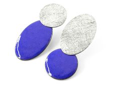 Enamel post earrings. Asymmetric post earrings. Modern blue earrings. Geometric silver post earrings. Modern stud earrings. Modern jewelry Textured silver post earrings with blue enamel. These asymmetric earrings are a one of a kind piece of contemporary jewelry. Measurements: 42mm length and 17mm width. Closure: push back. Very comfortable and lightweight. Ideal to wear daily or on a special occasion. These modern stud blue earrings are articulated at the back, offering a slight movement. These Contemporary Blue Jewelry For Gifts, Modern Blue Metal Earrings, Modern Blue Sterling Silver Earrings, Blue Contemporary Earrings As Gift, Contemporary Blue Earrings For Gift, Red Statement Earrings, Teal Earrings, Asymmetrical Earrings, Contemporary Earrings