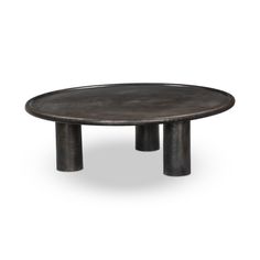 a round metal table with two legs and a black surface on the top, against a white background