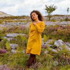 Mustard Tunic dress with button sleeves. Vibrant and beautiful, a uncomplicated sleeved tunic dress with large Button cuffs.  This design features a wide kneckline with medival kneck detail. The colour is a stunning Mustard colour which is beautiful to match with your Autumn or Spring time wardrobe.  This dress design works great layered with one of our vest or bodice designs.  ☆ Design Details ☆ ✔ Wooden buttons along the sleeve  ✔ Above knee length ✔ 100% cotton Vest seen in Pictures is not in Yellow Buttoned Knee-length Dress, Yellow Knee-length Buttoned Dress, Yellow Buttoned Dresses For Daywear, Yellow Button Closure Dress For Fall, Yellow Daywear Dress With Button Closure, Yellow Dress With Button Closure For Fall, Yellow Fall Dress With Button Closure, Fitted Linen Dress With Long Sleeves And Buttons, Yellow Long Sleeve Dress With Buttons