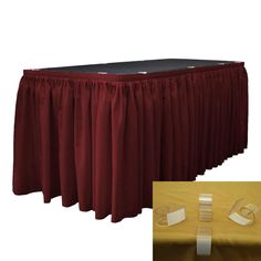 the table is covered with red pleated cloth