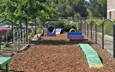 an outdoor play area with swings and slides