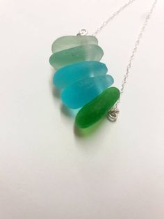 An Irish sea glass necklace made with small sea glass found on the beautiful Wild Atlantic Way of Ireland. This necklace makes a unique gift for a beach lover or someone special in your life. Comes on a sterling silver chain. If you prefer another colour, please indicate the colour in the notes to seller at check out. Comes in an elegant gift box ready as a gift. If you need a bigger quantity or any customized jewellery for your very special occasion (birthdays, weddings, bridal showers or any o Green Sea Glass Necklaces For Jewelry Making, Green Ocean-inspired Necklaces For Beach, Ocean-inspired Green Necklaces For Beach, Green Ocean-inspired Necklaces For The Beach, Green Sea Glass Necklace For Jewelry Making, Green Ocean-inspired Beach Necklaces, Turquoise Sea Glass Necklace For Beach, Bohemian Adjustable Sea Glass Necklaces, Beach Wedding Necklace