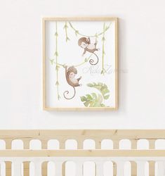 a baby's room with a monkey print on the wall