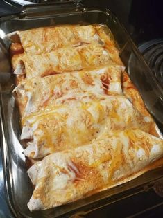 some food is sitting in a pan on top of the stove and ready to be cooked